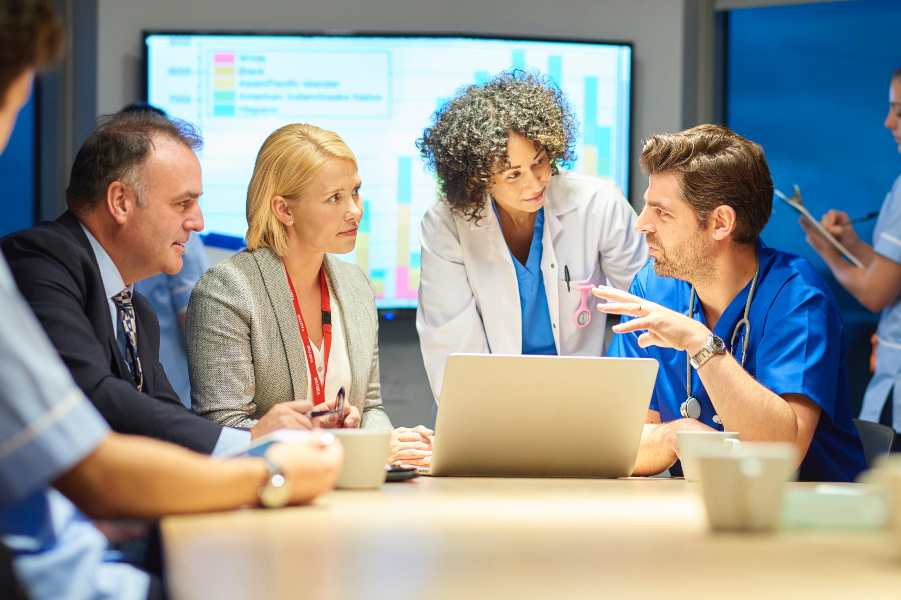 Photo of a group of people working around a table