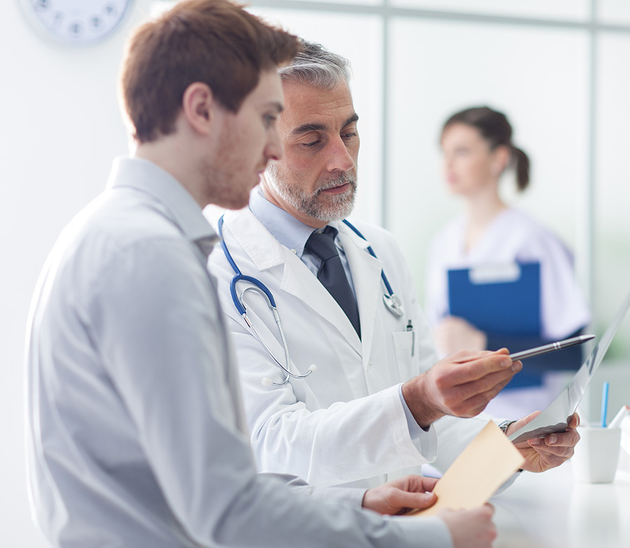 Image of doctors looking over some documents