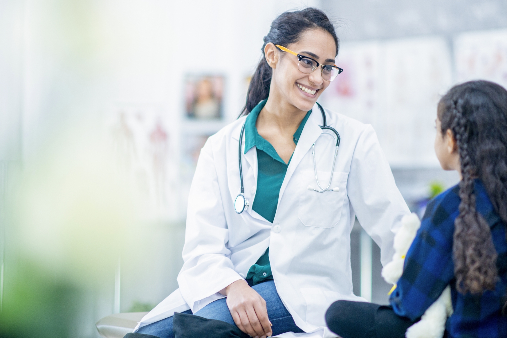 Pediatrician smiling at patient