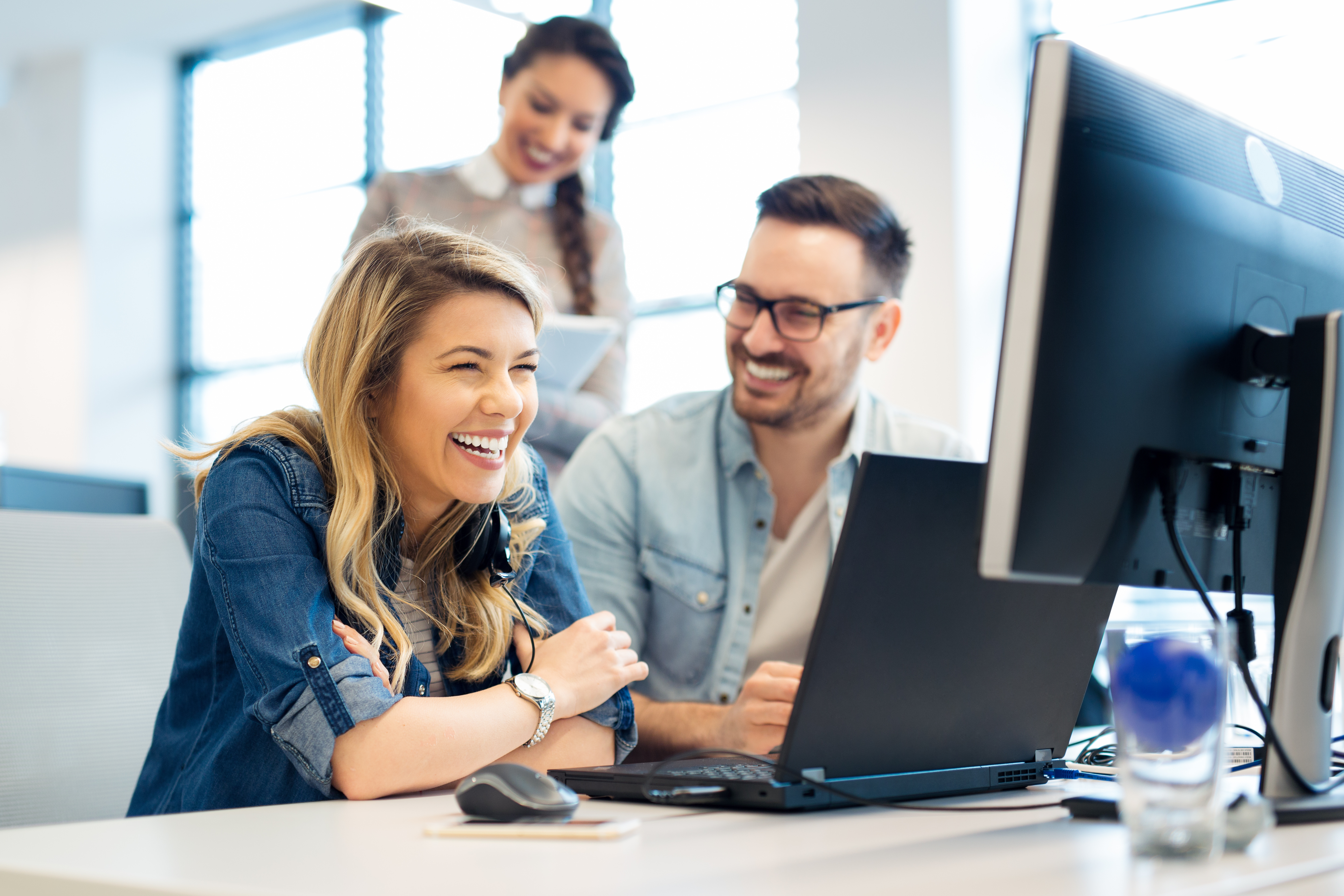 Happy people with PC stock