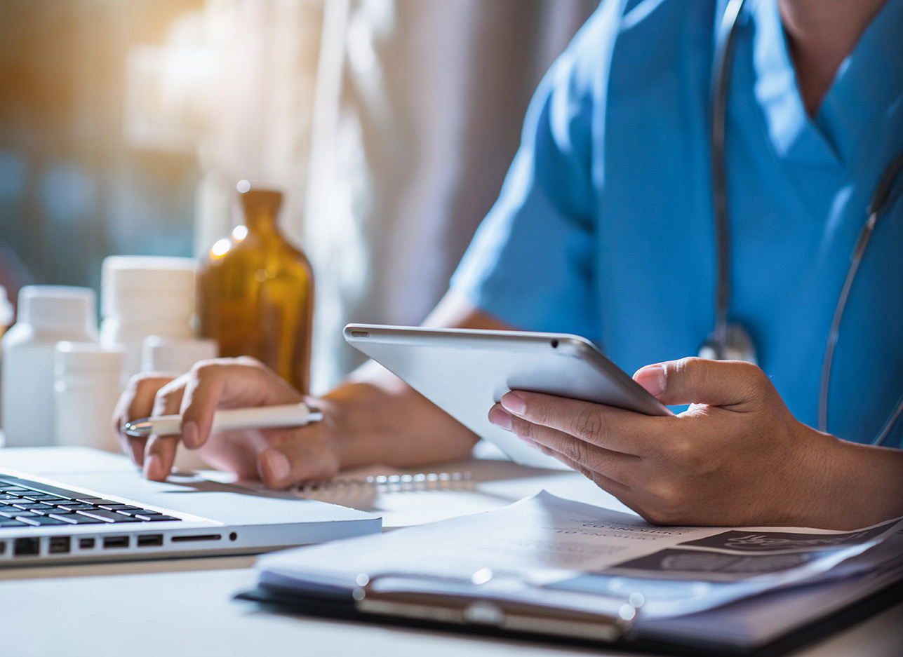 Thumbnail image of a doctor using multiple devices