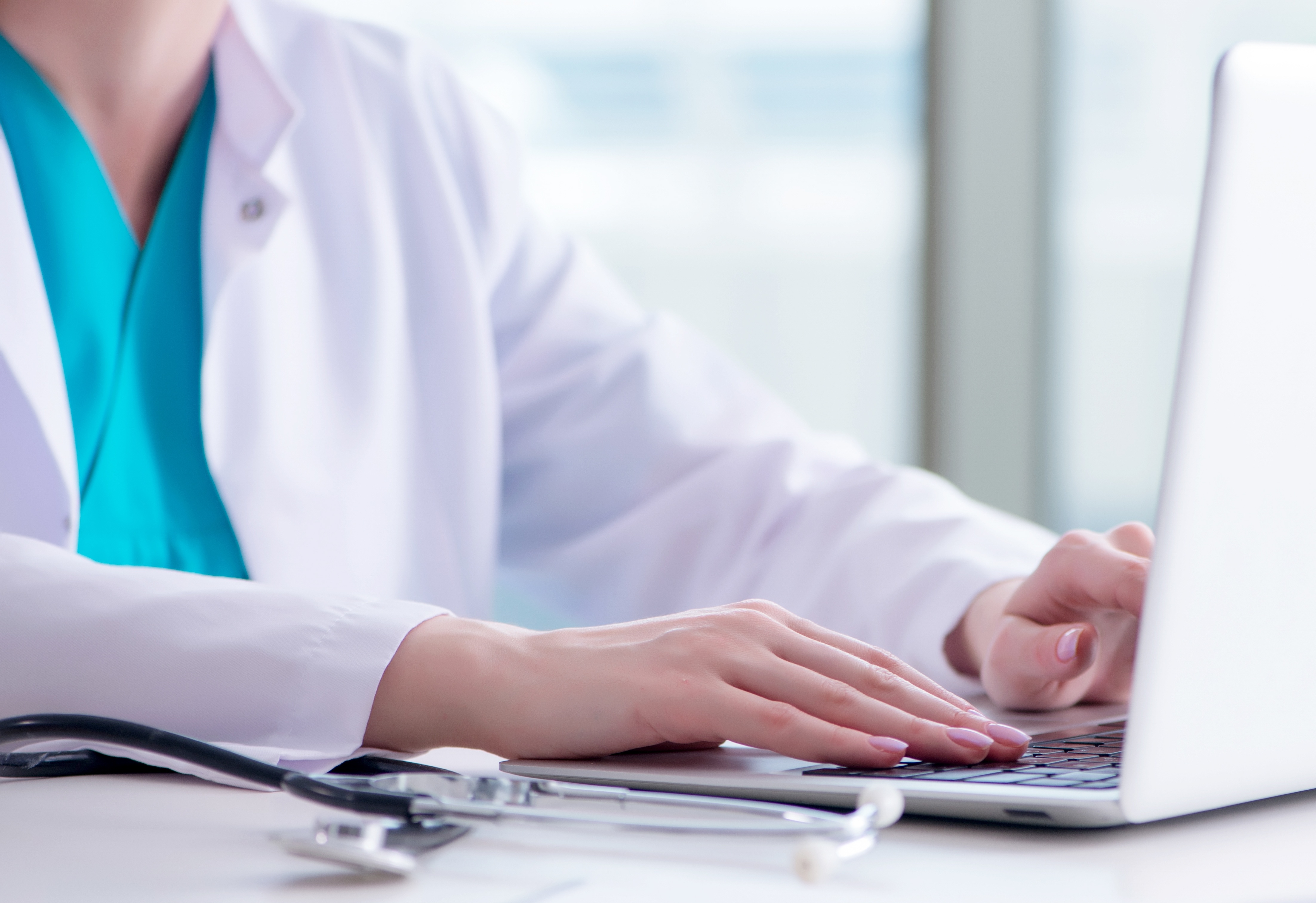 Healthcare worker on laptop