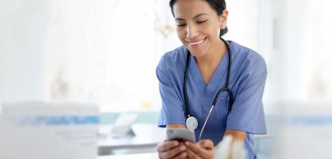 Image of a nurse viewing a phone