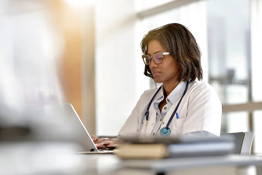 Doctor using a laptop